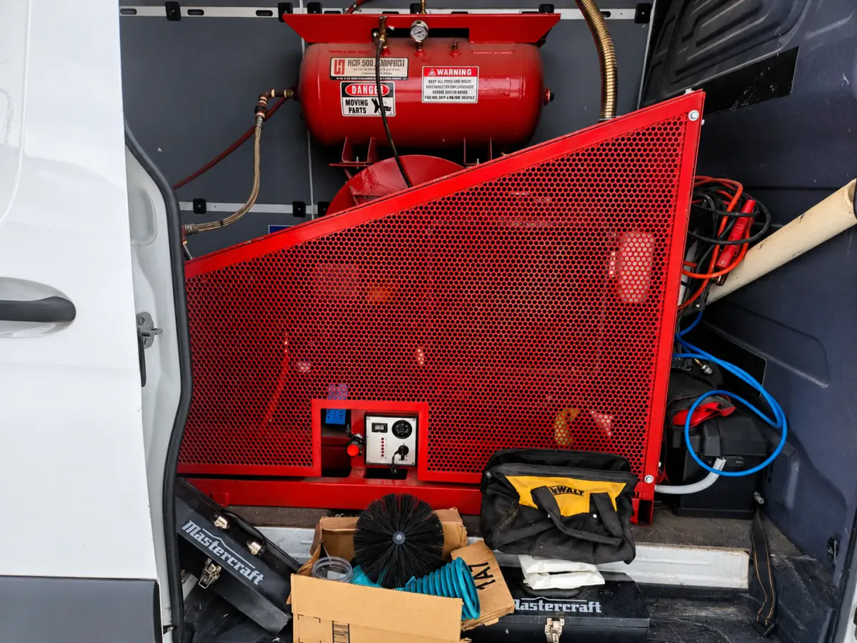 Believer Duct Cleaning professional duct cleaning equipment inside a service van