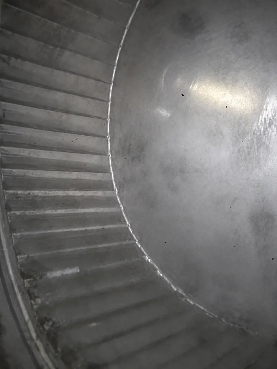 Interior blower wheel inspected during HVAC service